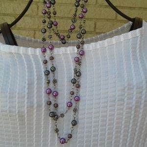 Purple beaded necklace with matching bracelet.